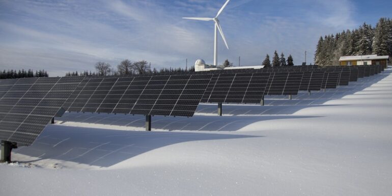 Solar panels and a windmill.