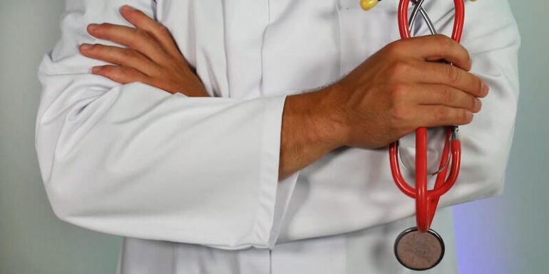 A doctor holding a stethoscope.